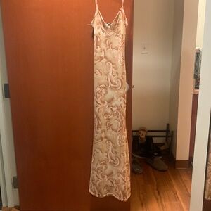 Maxi mermaid style dress with spaghetti straps. New and has the brand tag.